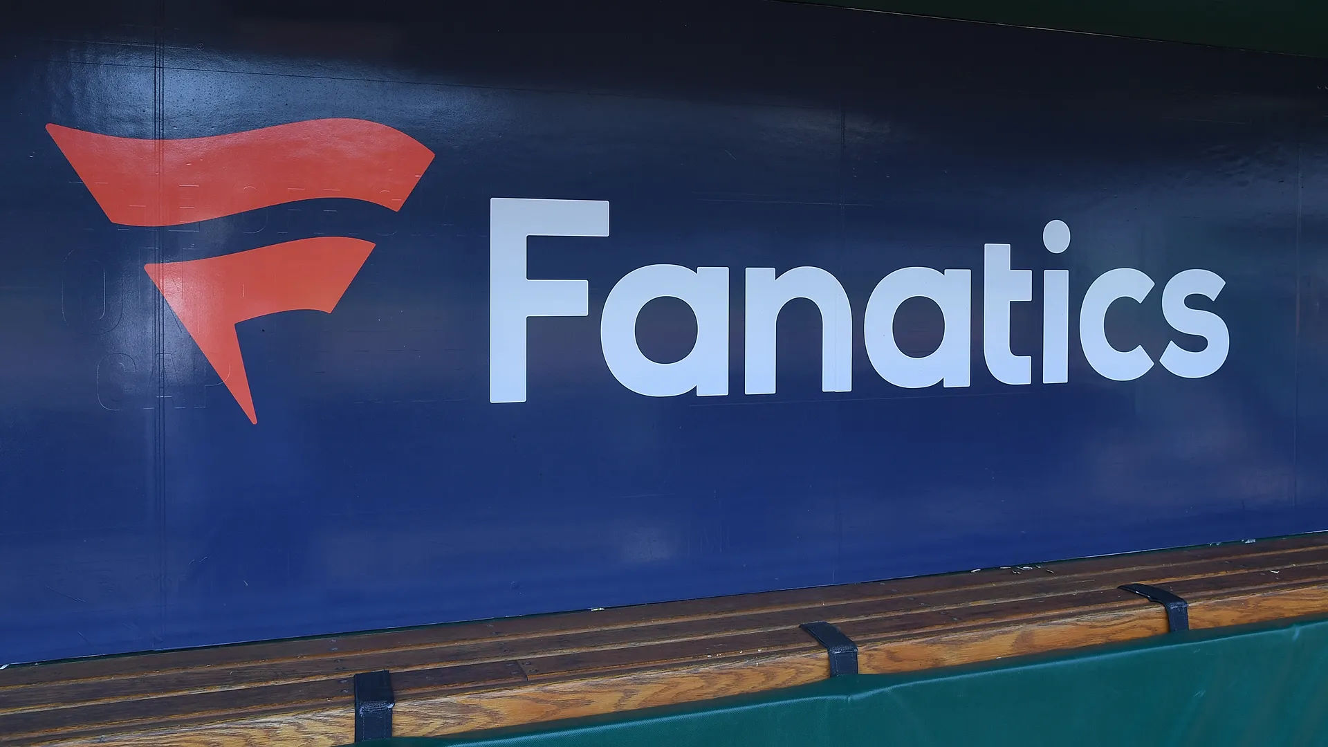 Fanatics logo is seen on the dugout wall before the game between the Pittsburgh Pirates and the Milwaukee Brewers at PNC Park on July 3, 2022 in Pittsburgh, Pennsylvania. Photo by Justin Berl/Getty Images